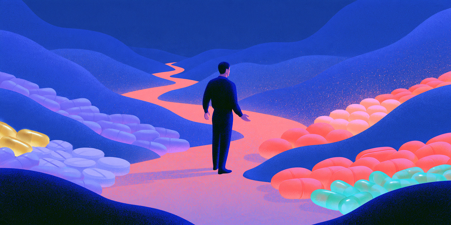 A man in a dark suit walks along a winding glowing path through rolling hills scattered with oversized pastel capsules and pills.