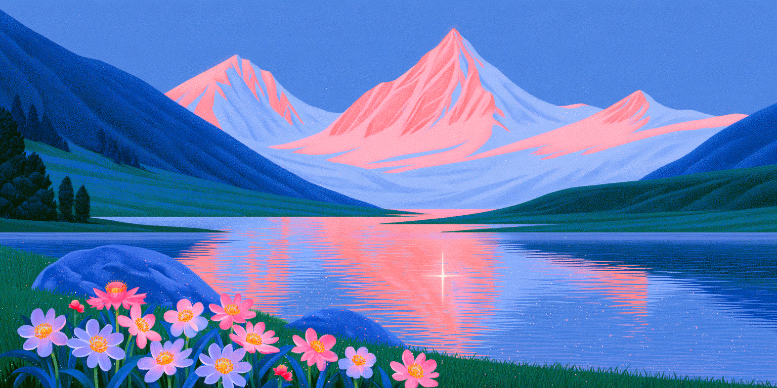A snowy pink mountain peak reflected in a calm lake, with wildflowers on the shore.